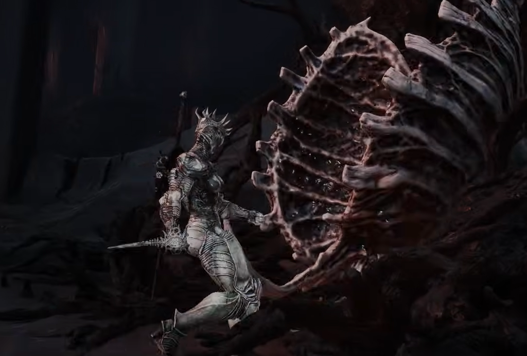 Monolith arena view showing the fleshy red gland after the boss encounter.